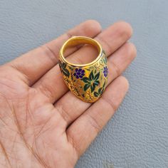 Mughal / Ottoman Silver Archer ring  Gold Guilded This is an archer thumb's ring made of Silver with real Gold guilded . It is nicely Multi color Enamel work with floral design .  This type of rings were used to protect the thumbs and was very famous in Royal Mughal court. The piece is in good condition. Dimension refer images Many Thanks for visiting my Store! We accept only PAYPAL we will ship via FedEx or any other international courier company. If you have any questions regarding payment, sh Ceremonial Temple Jewelry Ring With Meenakari, Traditional Hallmarked Engraved Ceremonial Ring, Traditional Ceremonial Engraved Hallmarked Ring, Ceremonial Meenakari Rings, Traditional Meenakari Ring Gift, Traditional Open Ring For Formal Occasions, Traditional Gold Enamel Ring For Ceremonial Occasions, Traditional Handmade Engraved Ring For Formal Occasions, Handmade Traditional Engraved Ring For Formal Occasions