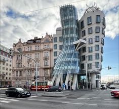 a very tall building sitting on the side of a road