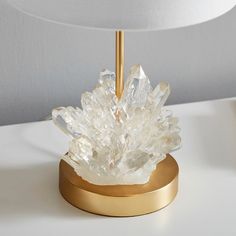 This gem of a lamp has shine that works overtime, thanks to the clear, cast-resin crystal that looks just like the real thing. The gold base and crisp linen shade give it extra polish.DETAILS YOU'LL APPRECIATE Expertly crafted with a sturdy iron base and resin crystals with a linen shade. Lamp base is finished in gold. On/off switch located on the cord. KEY PRODUCT POINTS Available in a set of 2. Two prong plug-in. Bulb (1): 60 watt type A bulb (not included). Conforms to UL standards - Dry Rate Velaris Bedroom, Room Decor Crystals, Geode Lamp, Lamp Pottery, Barn Bedrooms, Geode Decor, Crystal Room, Healing Light, Sophisticated Decor