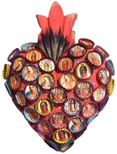 a heart shaped decoration with many pictures on it