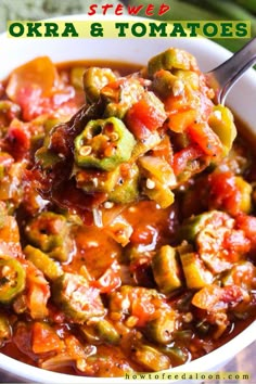 a white bowl filled with vegetable stew on top of a wooden table next to green beans