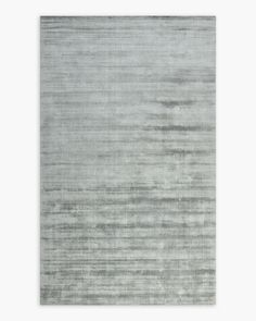 a gray rug with horizontal stripes on it