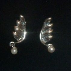 Beautiful Little Sterling Silver Feather Angel Wing Earrings. Brand New, With Box! These Are Stud Earrings With A Little Pearl That Dangles. Dainty & Feminine With Nice Shine. No Flaws. Measures .86” Long. From Non-Smoking Home, With Cats :) Winged Sterling Silver Earrings In Silver, Elegant Silver Angel Wings Jewelry, Elegant Angel Wings Earrings, Elegant Wing-shaped Metal Earrings, Elegant Silver Angel Wings Earrings, Unique Nose Rings, Sea Opal, Wedding Earrings Studs, Wedding Studs