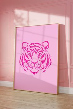 a pink poster with a tiger's head drawn on it in front of a pink wall