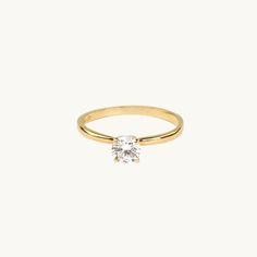 A delicate 18K gold ring with a white cz (cubic zirconia) stone.Mesaurements: Stone: 5 mm. The claw of the ring: 5,6 mm. Width and height of the ring rail: 1 mm. White Stone Ring, Dove Necklace, The Claw, 18k Gold Ring, Diamond Rings Bands, White Stone, Gold Plated Silver, Conflict Free Diamonds, Stone Ring