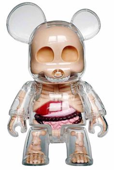 a toy figure with an open mouth and large ears on it's head is shown