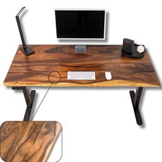 a computer desk with a monitor, keyboard and mouse on top of it next to a wooden table