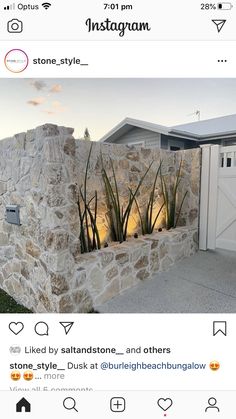 an instagram page with a stone wall and plants