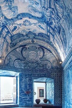 an ornately painted room with blue walls and flooring is seen in this image