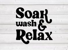 the words soap, wash and relax are shown on a white wood background with black lettering