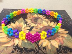 a multicolored beaded bracelet with sunflowers