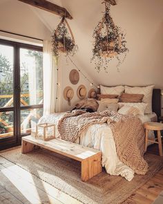 a bed sitting in a bedroom on top of a wooden floor next to a window