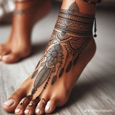 a woman's foot with tattoos on it