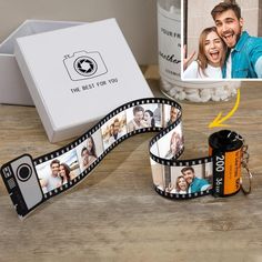 a couple's photo being taken on a film strip next to a box of popcorn