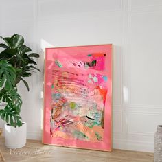 an abstract painting is displayed on the wall next to a potted plant and wooden floor