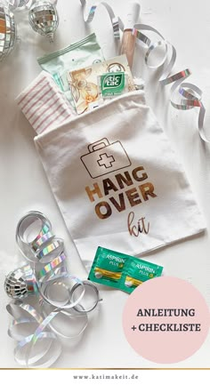 an assortment of personal care items on a table with text overlay that reads hang over kit