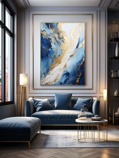 a living room with blue couches and paintings on the wall above them, along with a coffee table