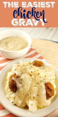 a white plate topped with mashed potatoes covered in gravy