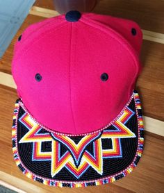 a pink hat sitting on top of a wooden floor