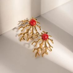 Discover Timeless Elegance with Our Gold Plated Coral-shaped Earrings Elevate your style with our exquisite Gold Plated Coral-shaped Earrings. Crafted from high-quality stainless steel and adorned with a lustrous 18k gold plating, these earrings exude luxury and charm. Featuring a unique coral-shaped design, these earrings add a touch of sophistication to any ensemble. Whether you're attending a party, celebrating an anniversary, or saying "I do" at a wedding, these earrings are the perfect accessory to complement your outfit. Key Features: Waterproof: Our earrings are crafted from stainless steel, making them waterproof and perfect for everyday wear. Whether you're caught in a sudden downpour or splashed at a pool party, rest assured that your earrings will retain their shine. Classic Des Metal Plug Earrings With Plating For Gift, Metal Plug Earrings With Plating As Gift, Plated Alloy Earrings As A Gift, Coral Earrings, Pool Party, Gold Plating, Classic Design, Timeless Elegance, Gold Earrings