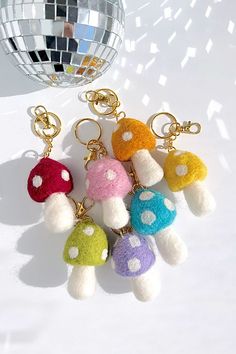 several key chains with different colored mushrooms on them