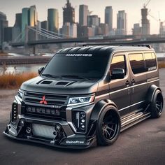 an suv parked in front of a city skyline