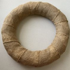 a close up of a burlap wreath on a table