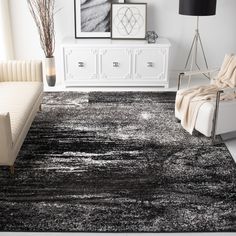 a black and white rug in a living room