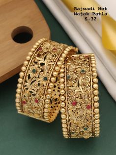 Description :- Indian bangle set/Metal bangles/Bridal Bangles/Designer bangle set for women/Wedding Jewelry/Festive Colorful Bangles/Bollywood jewelry set Gold Kada bangles /Indian bangles/Antique bangles/Temple Jewelry/Bridal Bangles/Indian Wedding/Pakistani Jewelry/South indian jewelry Gift yourself a royal look with this perfectly crafted necklace set from Manalisstudio. Crafted with high quality stones and pearls, it is impressive in design. The green enamel artwork adds perfect texture to t Bangles For Bride South Indian Weddings, Luxury Yellow Gold Temple Jewelry Bracelets, Luxury Gold Beads For Wedding, Gold Bangles Design Latest Indian, South Indian Bangles, Bangles Jewelry Designs Gold, Gold Indian Jewelry, Kada Bangles