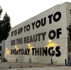 an advertisement on the side of a building that says it is up to you to see the beauty of everyday things