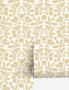 an image of a wallpaper with gold leaves and flowers on white background, both side by side