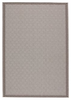 a gray rug with white trimmings on it