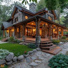 a stone and wood house in the woods with steps leading up to it's front door