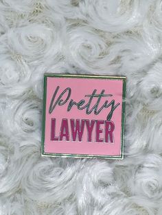 a pink pin with the words prettyy geo on it