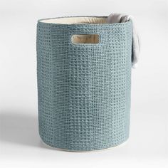 a large blue basket with a handle on it