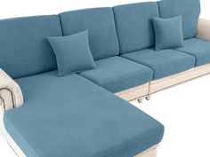 a blue couch and ottoman with pillows on it's back end, viewed from the front