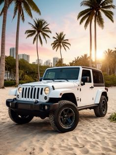 a white jeep parked on top of a sandy beach next to palm trees and buildings