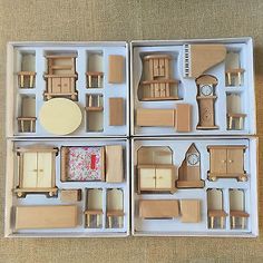 four wooden furniture pieces in a box on the floor, with one piece cut out to show it's contents