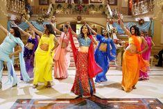 women in colorful sari dancing on the dance floor