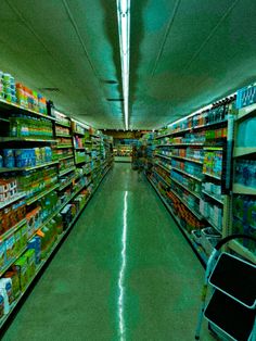 an empty grocery store aisle filled with lots of food