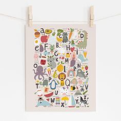 Whimsical kids alphabet poster with animals and objects in pastel colors and a light beige background