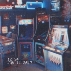 an old time video game room with arcade machines