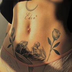 a woman with a skeleton tattoo on her stomach and the words can be seen above it