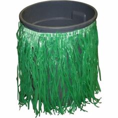 a tin can covered in green grass with the words hula skirt trash can cover