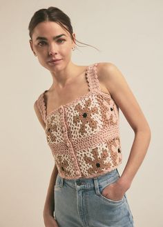 a woman wearing a top with an animal print on the front and back, standing in jeans