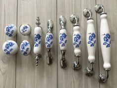 blue and white knobs and handles on wooden surface