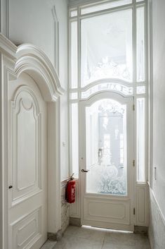 a white door and window in a room