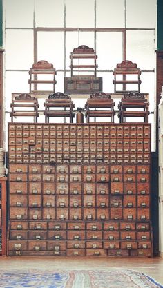 an old wooden dresser with many drawers