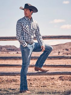 CLASSIC WESTERN STYLE WITH A TAILORED FIT When you want to look good but be ready for anything the day brings, Wrangler® 20X® slim fit jeans have your back. These Western-inspired jeans sit just below the waist and they come with a slim seat and thigh as well as a straight leg that fits over boots. Plus, our men's 20X® No. 44 slim fit straight leg jeans feature all the authentic Wrangler® details you know and added stretch to keep you moving in total comfort. Every wash of our men's 20X® straigh Cowboy Outfits For Men, Western Outfit Men, Mens Country Style, Mens Cowboy Style, Cowboy Outfit Men