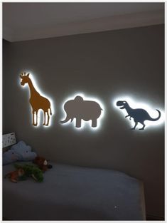 three different types of animals are on the wall